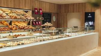 An inviting counter with a wide selection of baked goods and elegant presentation