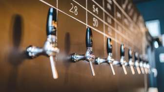 Close-up of beer taps at the Liechtenstein Brewery