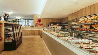 Sales counter at Café Wanger with a variety of cakes and other treats on display
